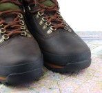 leather hiking boots and map as a travel/orientation concept